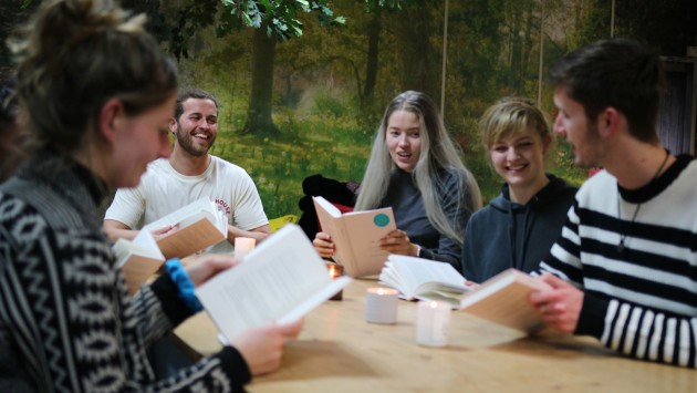 Image of students discussing books