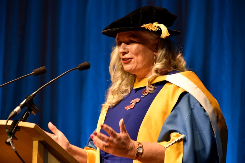 Head and shoulders photo of Alison in her robes speaking at the lecturn