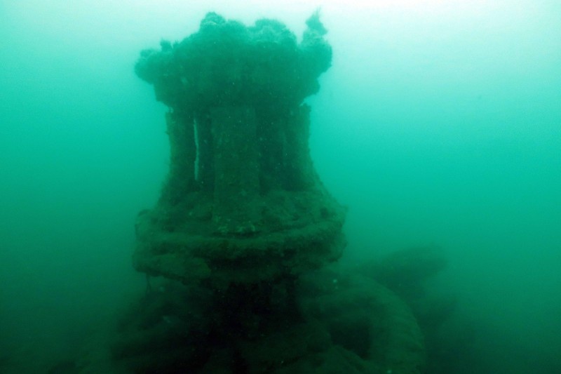 A capstan on the wreck, under water 