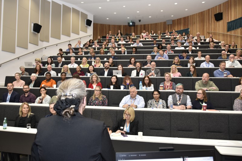 The crowd listening to the Conference sat in rows in a lecture theatre