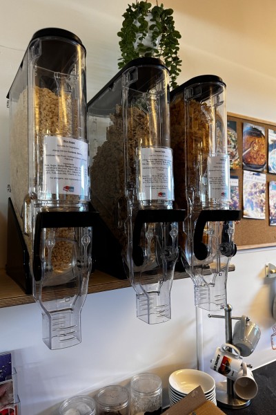 Three cereal dispensers located at SUBU Community Kitchen.