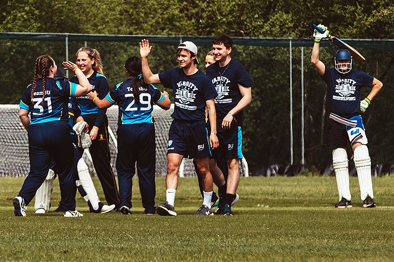 Image of Bournemouth University students playing cricket