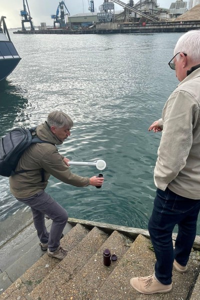 Neil Duncan-Jordan MP and Dan Franklin collecting water at Poole Quay